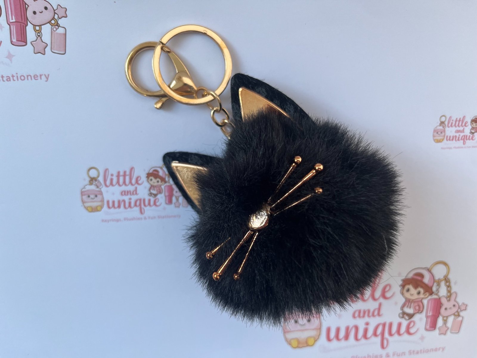 Black Fluffy Cat Keychain – Gold Detail